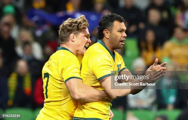 Kurtley Beale of the Wallabies celebrates with Michael Hooper of the Wallabies after scoring the first try during the International test match...