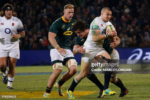 South Africa's lock Franco Mostert tackles England fullback Mike Brown during the second test match South Africa vs England at the Free State Stadium...