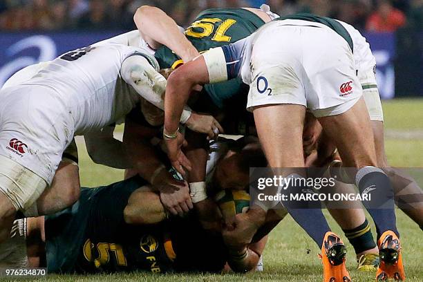 England's fullback Mike Brown is tackled during the second test match South Africa vs England at the Free State Stadium in Bloemfontein, on June 16,...