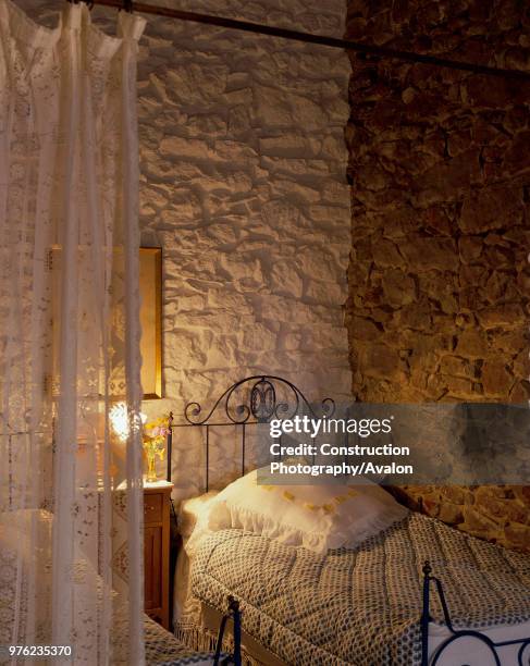 View of two single beds in a cozy bedroom.