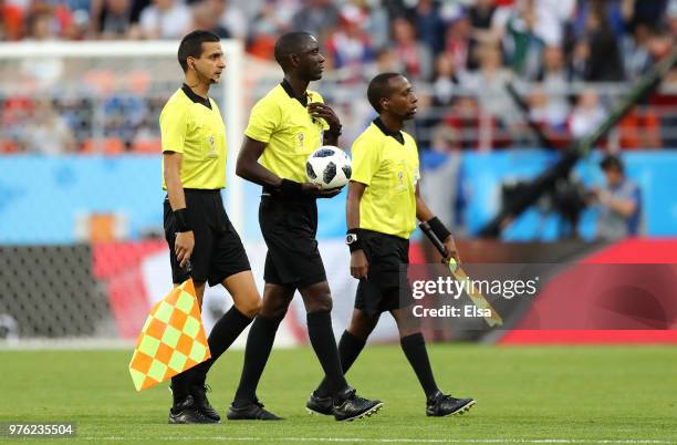 Assistant referee Mehdi Abid Charef, Referee Bakary Gassama and Assistant Jean Claude Birumushahu referee during the 2018 FIFA World Cup Russia group...