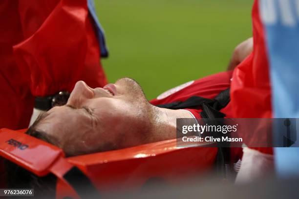 William Kvist of Denmark is carried off the pitch on a stretcher during the 2018 FIFA World Cup Russia group C match between Peru and Denmark at...