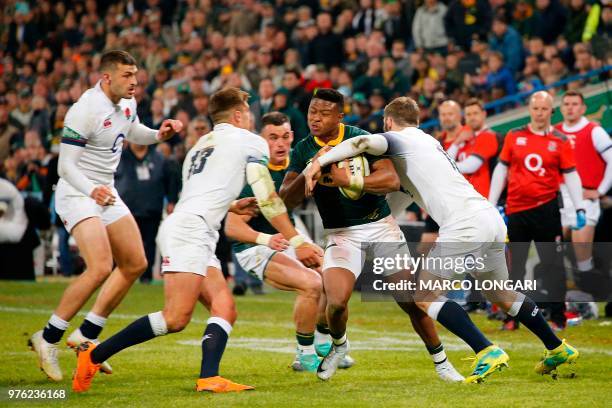 South Africa wing S'busiso Nkosi is tackled by England fullback Elliot Daly during the second test match South Africa vs England at the Free State...