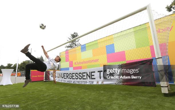 An employee kicks a ball into the goal used by the German national football team in the match in which it won the 2014 World Cup against Argentina,...