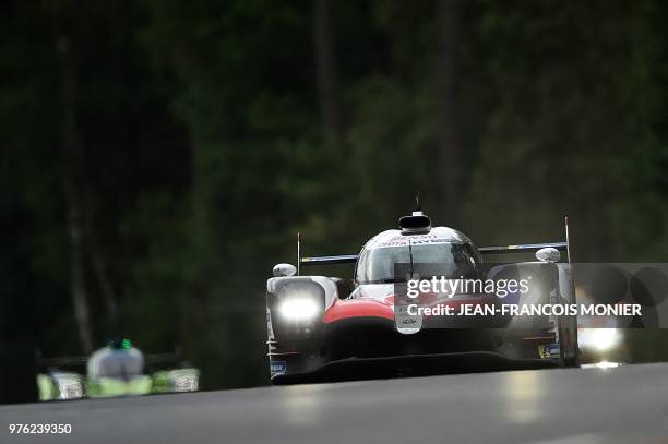 Toyota TS050 Hybrid LMP1 Spain's driver Fernando Alonso leads during the 86th Le Mans 24-hours endurance race, at the Circuit de la Sarthe on June...