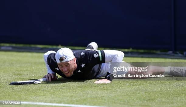Illya Marchenko of the Ukraine slips on court during Day One of the Fuzion 100 Ikley Trophy at Ilkley Lawn Tennis & Squash Club on June 16, 2018 in...