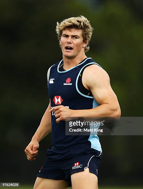 Berrick Barnes talks to team mates during the Waratahs Super 14 training session at Moore Park on March 11, 2010 in Sydney, Australia.