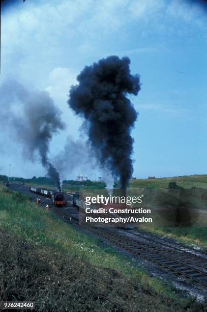 Cadley Hill Colliery on the Derbyshire coalfield with Drakelow power station in the background. The engines are; left, Progress, an 0-6-0ST built by...