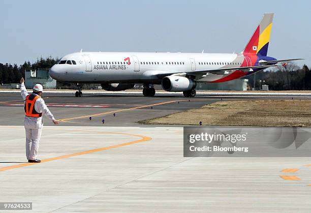 An Asiana Airlines Inc. Plane taxis at Ibaraki Airport in Omitama City, Ibaraki prefecture, Japan, on Thursday, March 11, 2010. Ibaraki Airport, a...