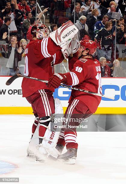 Shane Doan of the Phoenix Coyotes congratulates teammate Ilya Bryzgalov after a shootout victory over the Vancouver Canucks on March 10, 2010 at...