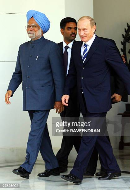 In this picture taken on January 25 then Russian President Vladimir Putin and Indian Prime Minister Manmohan Singh arrive for a meeting at Hyderabad...