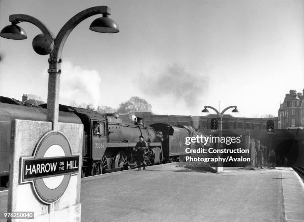 Harrow on the Hill and a London, Marylebone train double headed by the closely related former LMS Black 5 and a BR Standard 5, circa 1960.