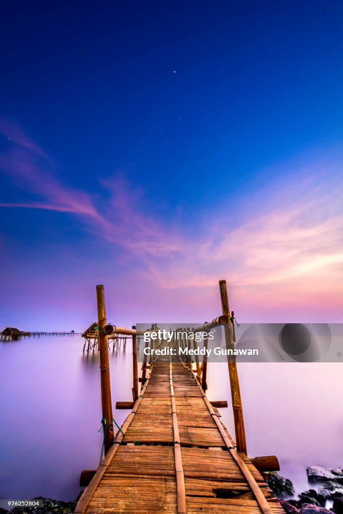 Seascape with old wooden pier, Tangerang, Indonesia