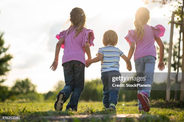 201 Children Running Back View Stock Photos, High-Res Pictures, and ...