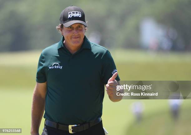 Phil Mickelson of the United States acknowledges the crowd singing "Happy Birthday" on the third green during the third round of the 2018 U.S. Open...