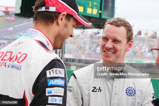 Alex Wurz of Austria and Toyota Gazoo Racing with actor Michael Fassbender of Ireland on the grid before the start of the Le Mans 24 Hour race on...
