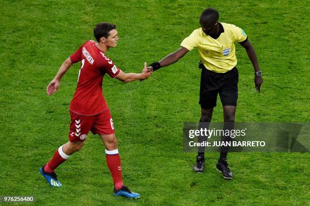 Denmark's defender Andreas Christensen shakes hands with Gambian referee Bakary Gassama before going off as a substitute during the Russia 2018 World...