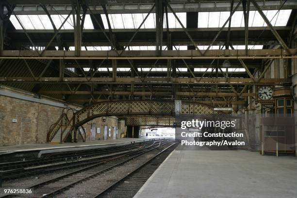 View of one of the footbridges at Perth station, Parthshire, showing the staircase access to the bridge, the clock and the platform canopy 30th May...