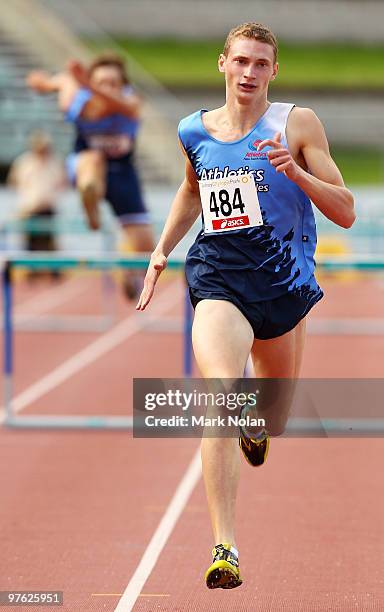 Steven Solomon of Queensland competes in the Under 20 boys 400 metre hurdles during day one of the 2010 Australian Junior Championships at Sydney...