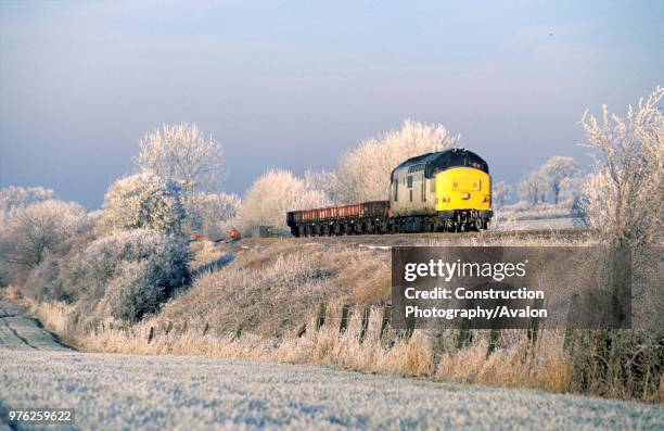 Class 37 diesel electric at the head of an engineers train in frosty conditions on the Midland Main Line, circa 1995.