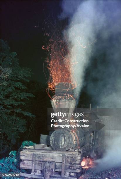 Colouring the night sky with fire- wood burning Shay No 10 of the Insular Lumber Company on the Philippine island of Negros shuffles along between...