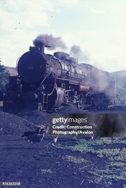 Some fire action on a Vulcan 'Skyliner' 2-10-0 heads southwards for Sumucuk with a coal train from the Black Sea collieries. 88 of these powerful...