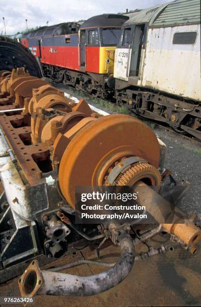 Scrapped diesel locomotives with traction motor in the foreground awaiting disposal. C2002.