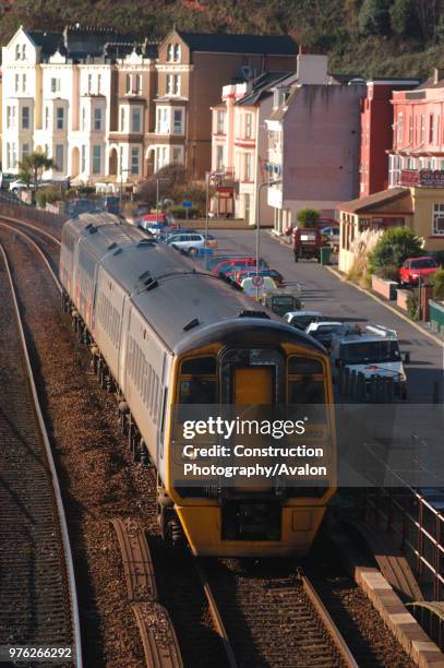 The Great Western Railway. A Penzance - Manchester Victoria approaches Dawlish station. October 2004, United Kingdom.