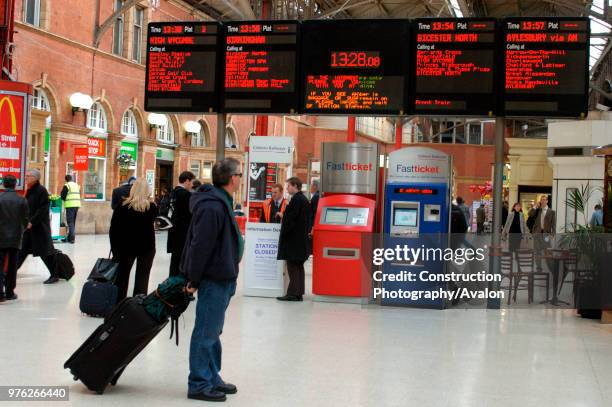 View of the main concourse at Marylebone showing automatic ticket machines and computerised departure board. February 2005.