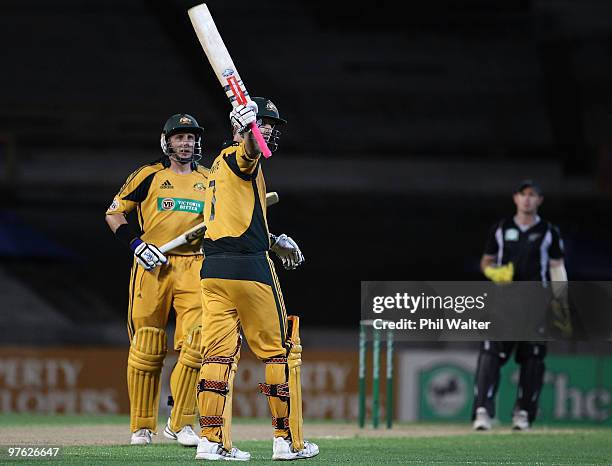 Cameron White of Australia celebrates his 50 runs during the fourth One Day International match between New Zealand and Australia at Eden Park on...