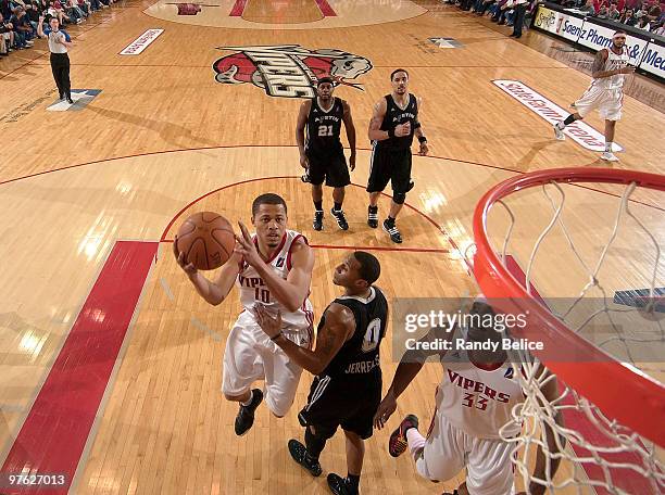 Jonathan Wallace of the Rio Grande Valley Vipers is fouled by Curtis Jerrells the Austin Toros while driving to the basket during the NBA D-League...