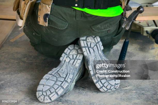 Close up on construction worker safety shoes.