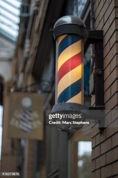 arcade barbers - barber pole stock pictures, royalty-free photos & images