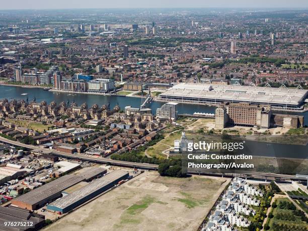 Aerial view of Royal Victoria Dock and Excel looking North towards Canning Town, Docklands, London, UK.