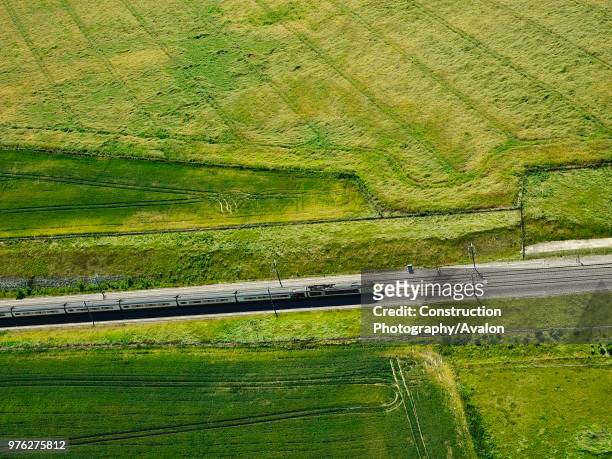Aerial view of a train near River Medway, Kent, UK.
