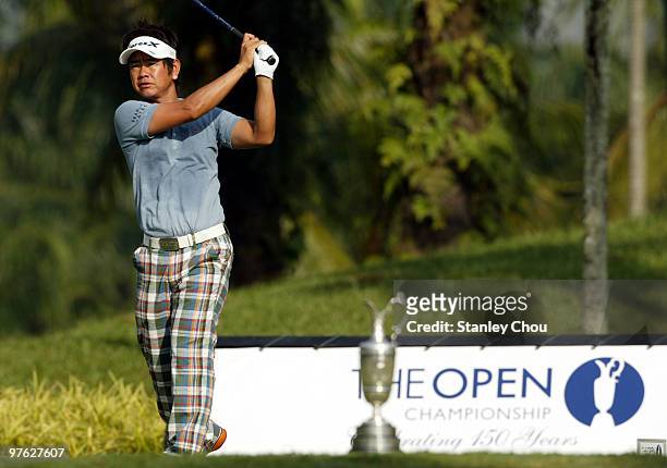 Hiroyuki Fujita of Japan watches his tee shot on the 1st tee during Asian International Final Qualifying for The Open at Saujana Golf and Country...