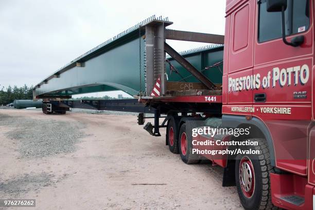 Special vehicles required to transport composite bridge sections to the site.