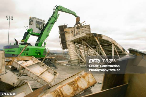 The machine making sort work of scrapping the casting bed.