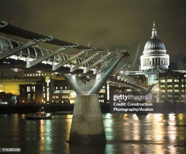 Millennium Bridge and St Pauls Cathedral at night. London, United Kingdom. Bridge designed by Norman Foster and Partners.