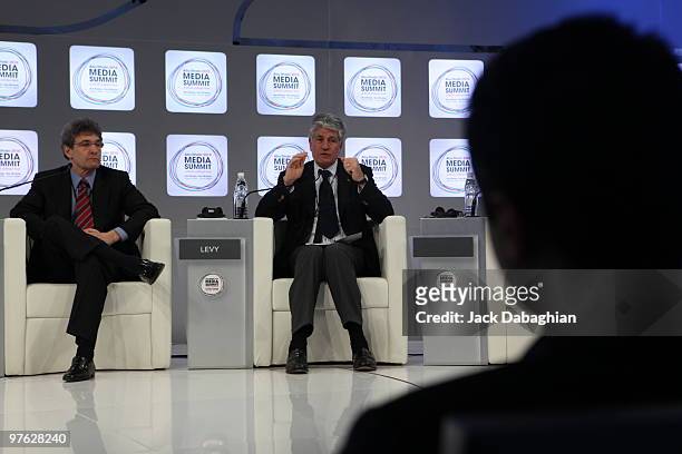 Maurice Levy Chairman and CEO Publicis Group gestures as Warner Bros President and COO Alan Horn looks on during a panel discussion at the Abu Dhabi...