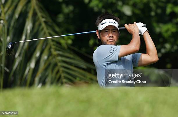 Hiroyuki Fujita of Japan watches his tee shot on the 4th hole during Asian International Final Qualifying for The Open at Saujana Golf and Country...