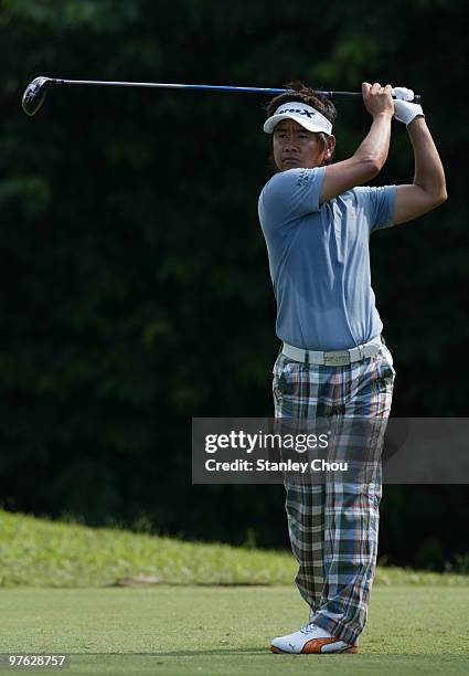 Hiroyoki Fujita of Japan wathces his shot on the 5th hole during Asian International Final Qualifying for The Open at Saujana Golf and Country Club...