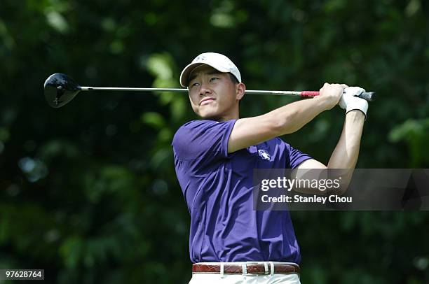 Eric Chun of South Korea watches his shot on the 8th hole during Asian International Final Qualifying for The Open at Saujana Golf and Country Club...