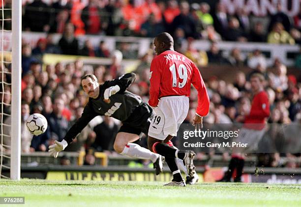 Dwight Yorke of Man Utd scores the first goal of the match during the FA Carling Premiership match between Manchester United and Arsenal played at...