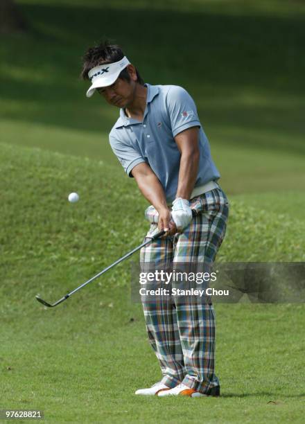 Hiroyuki Fujita of Japan chips on the 4th green during Asian International Final Qualifying for The Open at Saujana Golf and Country Club on March...