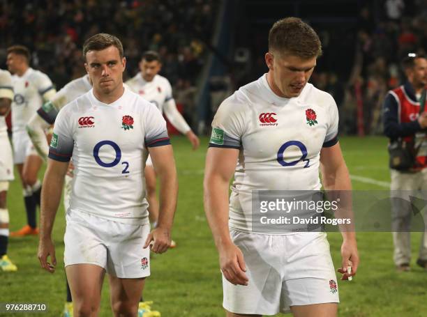 England captain, Owen Farrell looks dejected with team mate George Ford after their defeat during the second test match between South Africa and...
