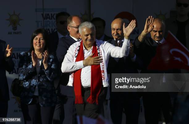 Turkish Prime Minister and Vice Chairman of Turkey's ruling Justice and Development Party, Binali Yildirim greets people during AK Party's election...