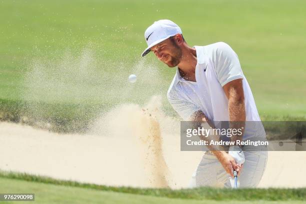 Kevin Chappell of the United States plays a shot from a bunker on the 14th hole during the third round of the 2018 U.S. Open at Shinnecock Hills Golf...