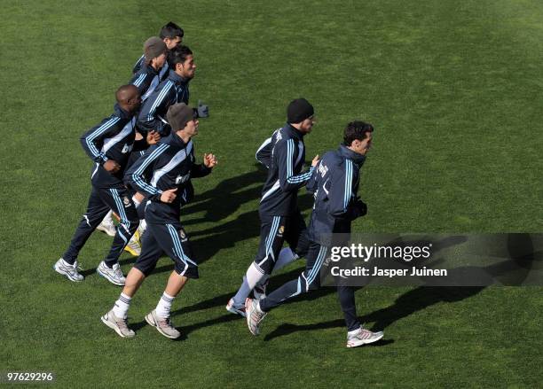 Kaka of Real Madrid runs with goalkeeper Iker Casillas and other teammates during a training session the day after Real Madrid's UEFA Champions...