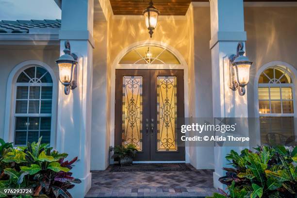 front door with lights - alvida stock pictures, royalty-free photos & images